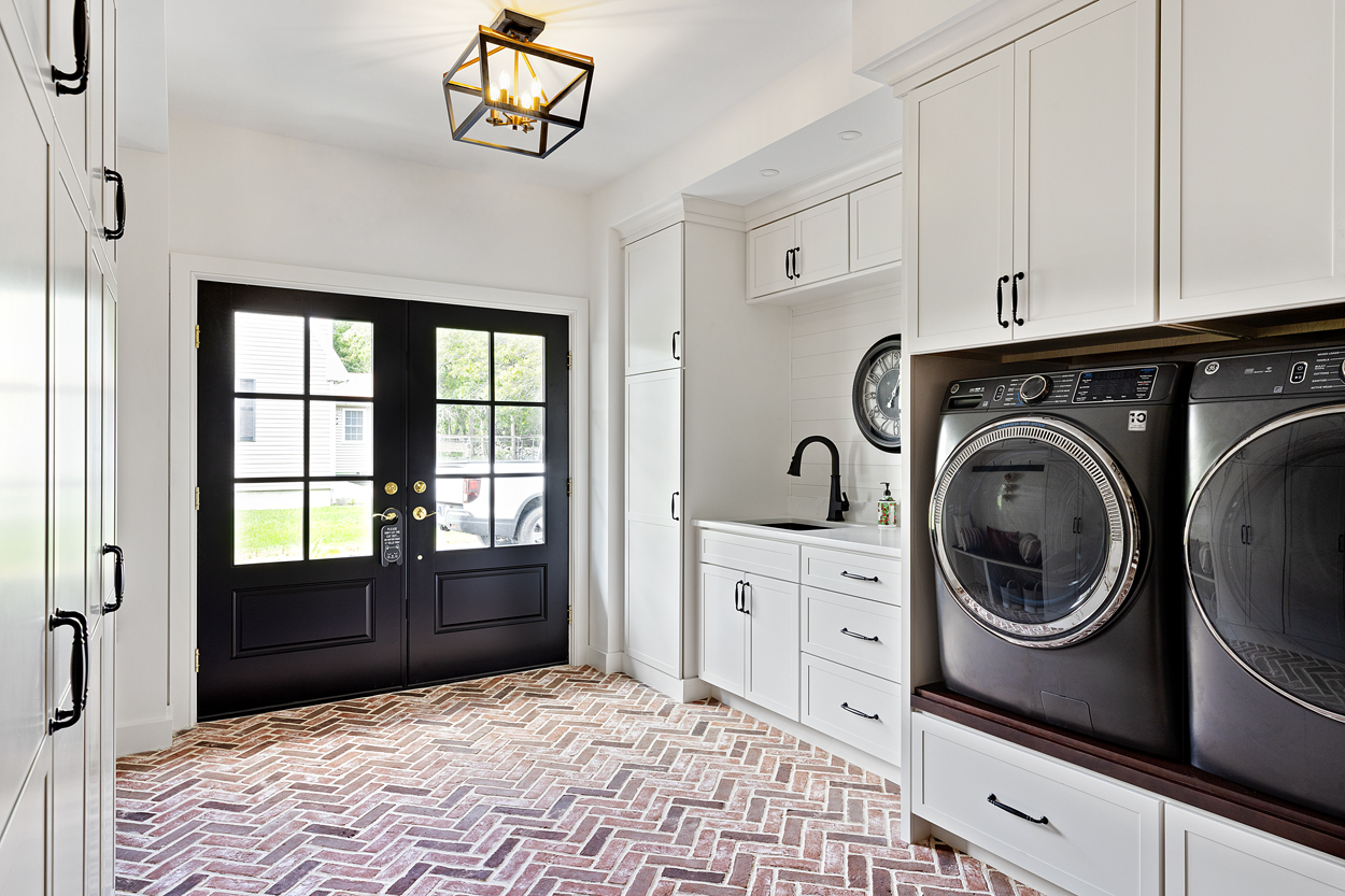 Herringbone durable floor tiles that can actually take the daily beating, from wet boots and snow melt to muddy paws, while still keeping the space clean, polished, and pulled together