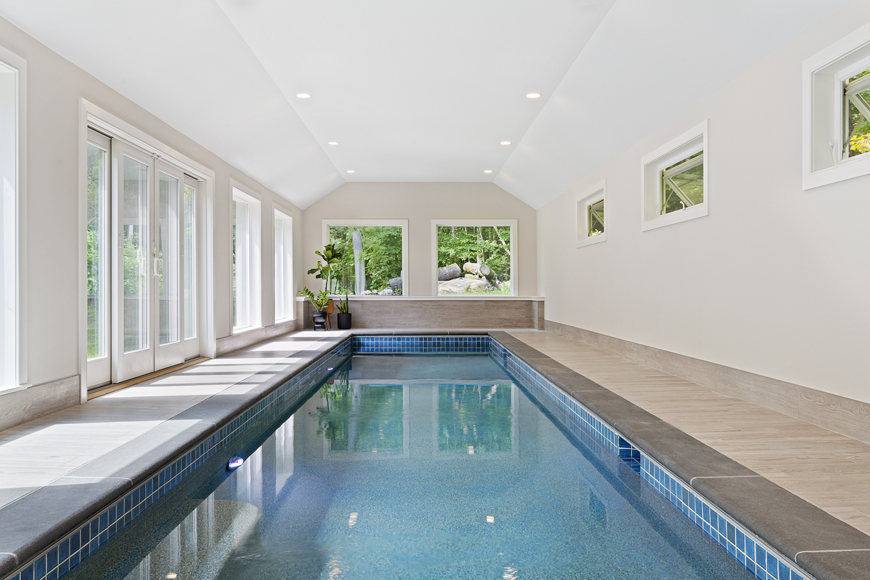 Vaulted ceilings and abundant natural light transform this indoor pool into a year-round retreat