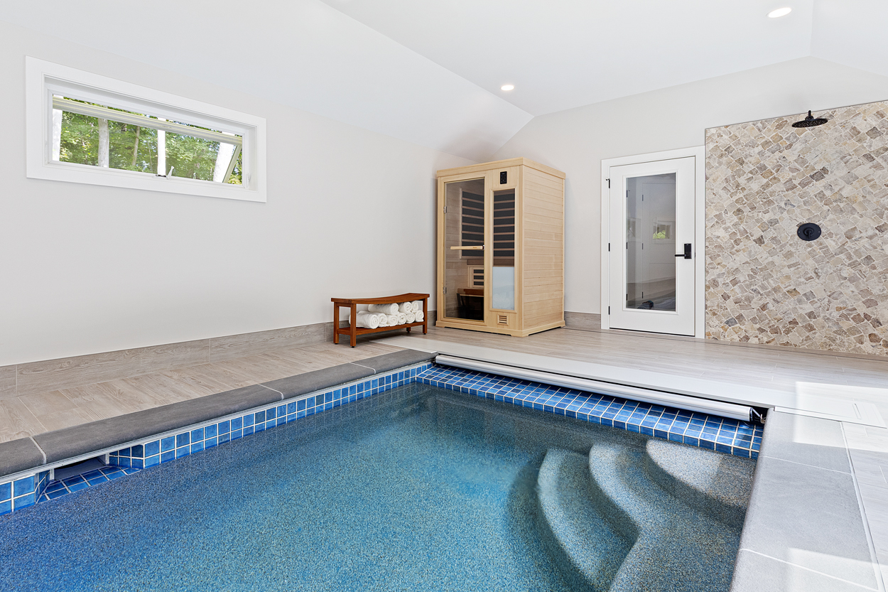 An infrared sauna stands ready alongside the pool, delivering resort-caliber amenities for daily rejuvenation and multigenerational wellness
