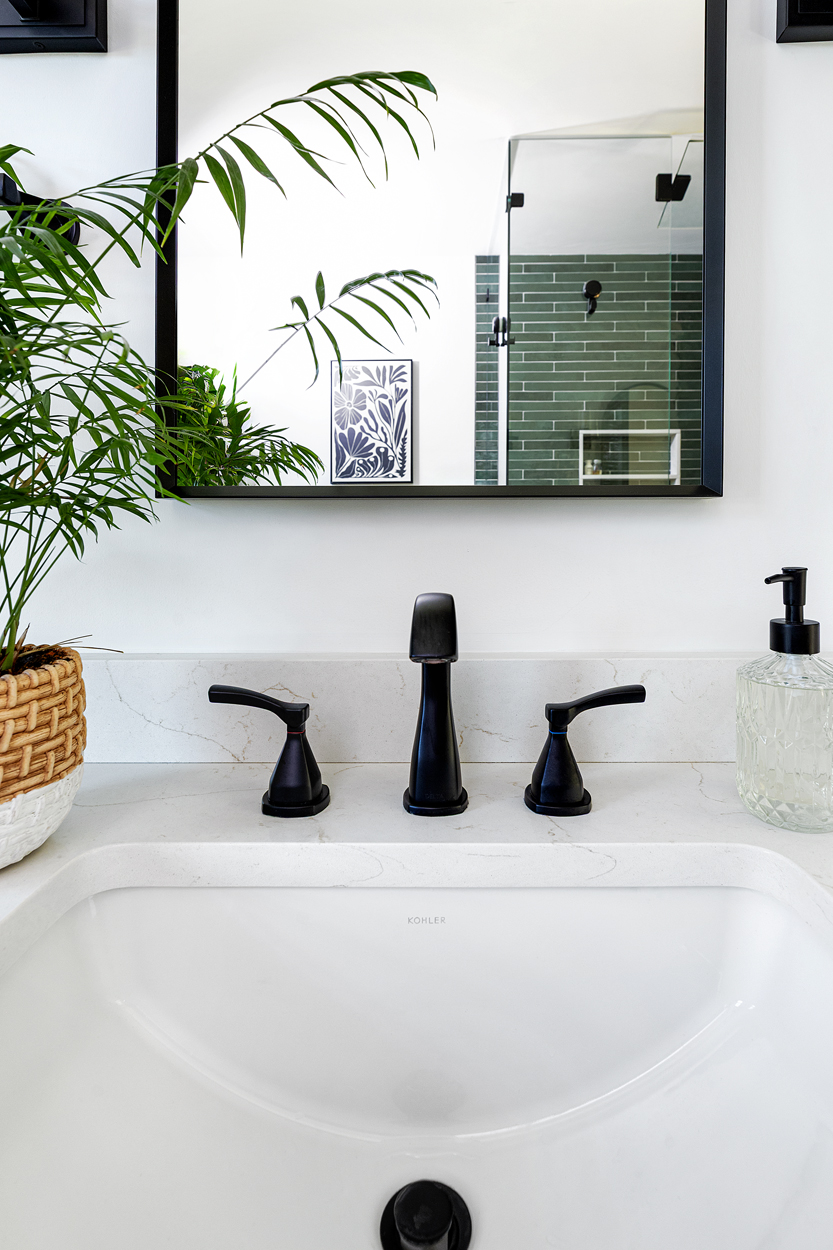  New undermount sinks, updated trim at both the sink and shower, and matte black mirrors and sconces complete the palette, lending the room a refined, cohesive character without sacrificing function.