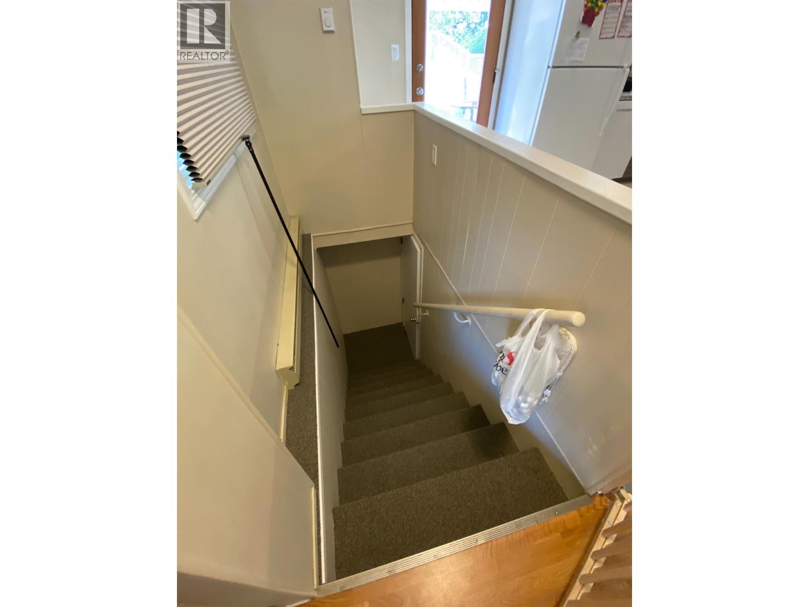 Stairs to laundry/storage- Main Unit Access Only
