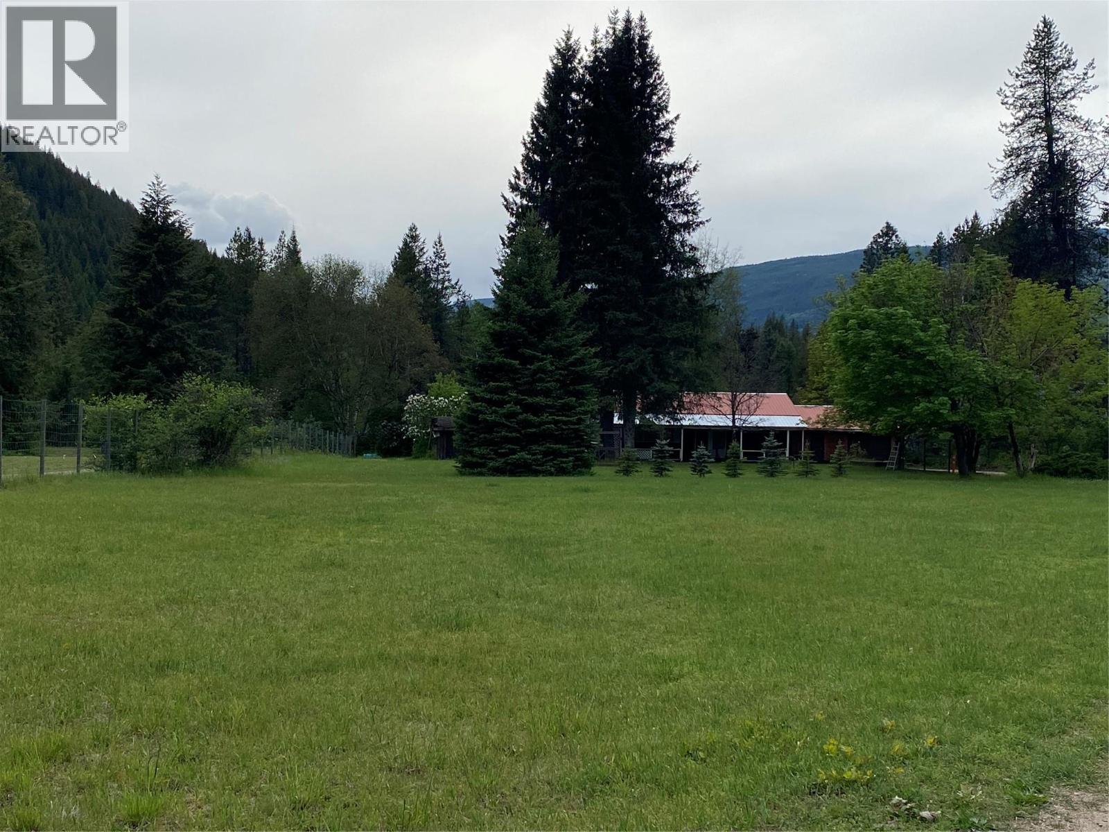Front yard of the brown house.