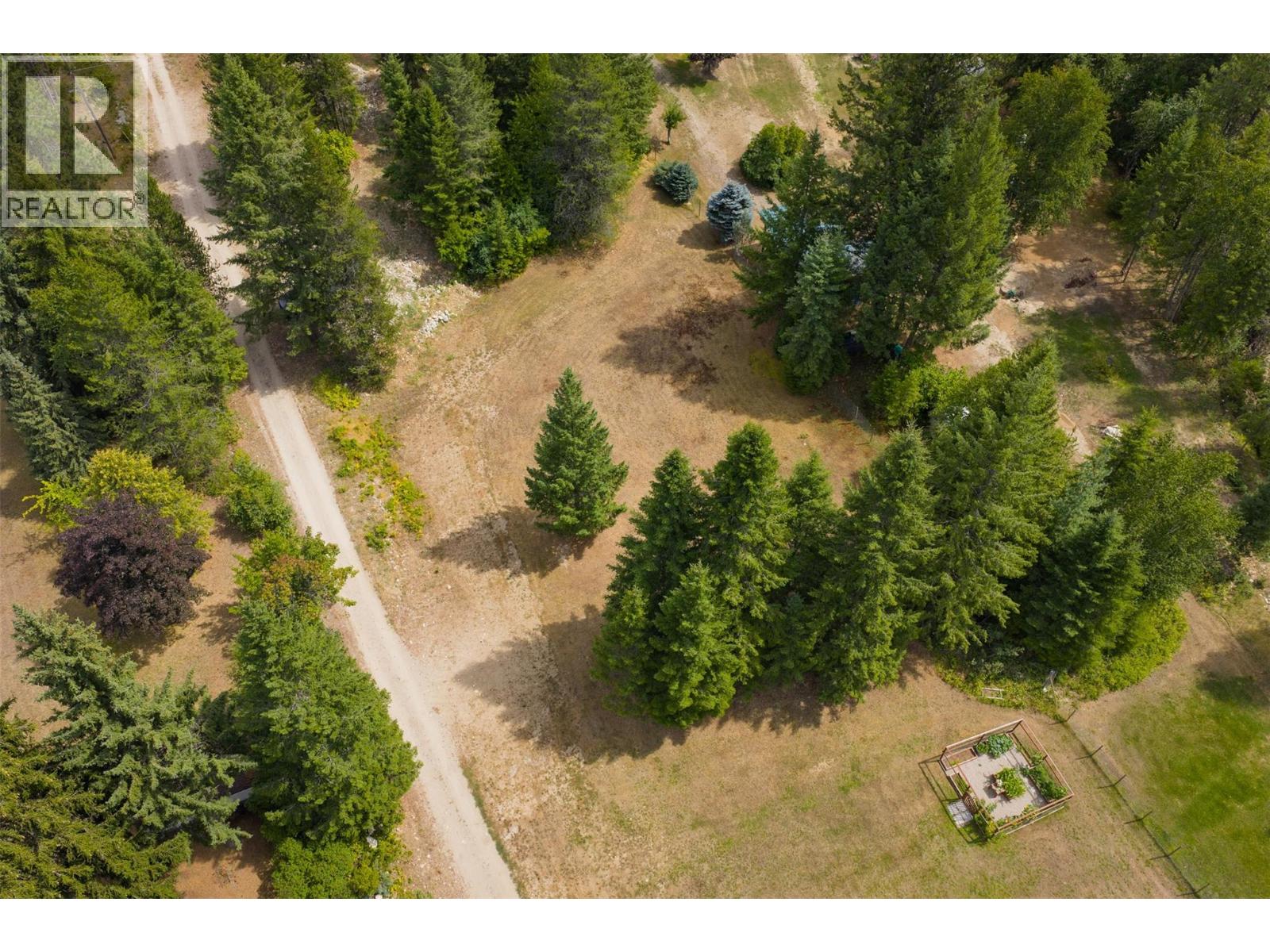 Acreage between the main house and the brown house.