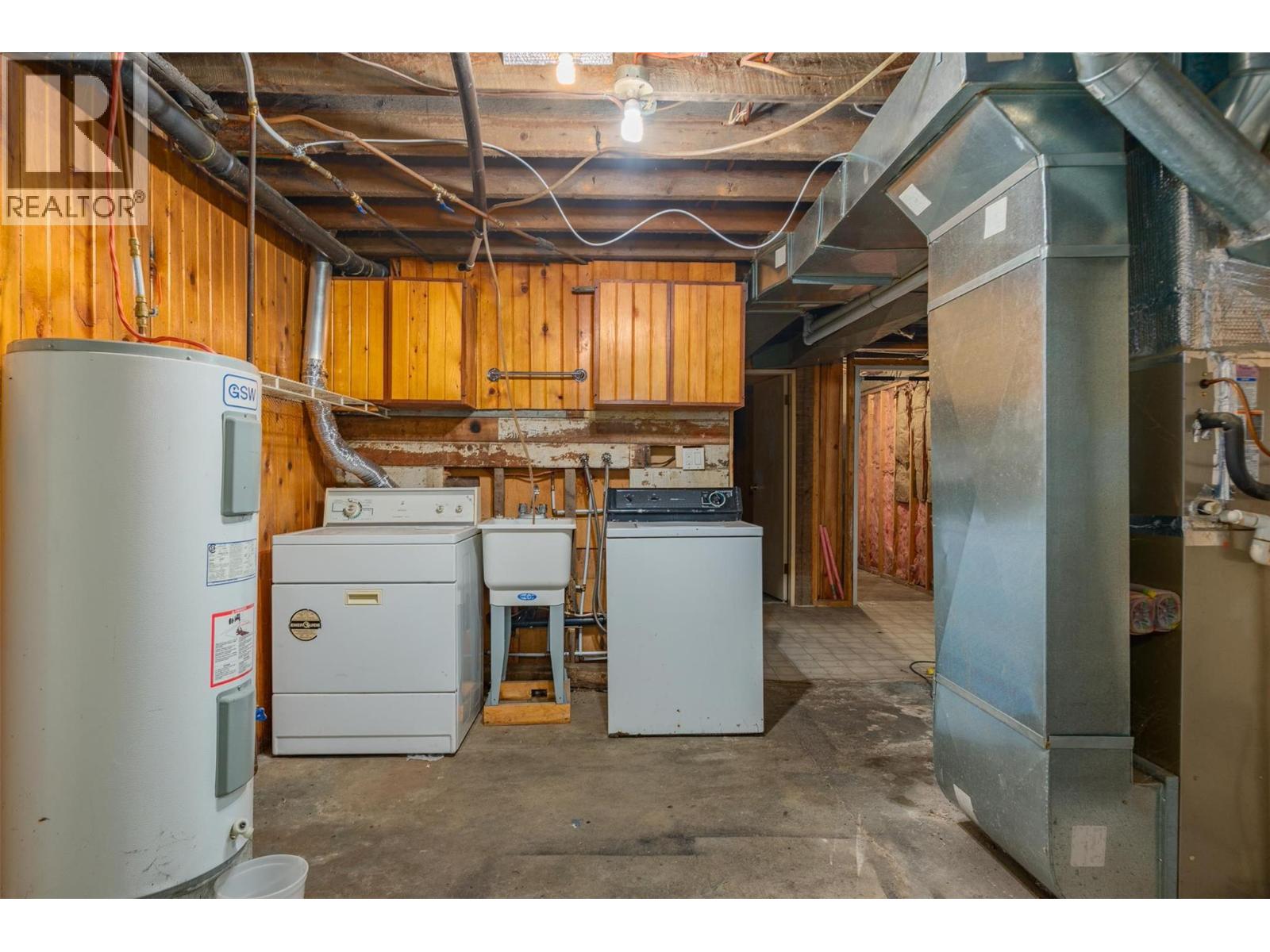 Unfinished basement of the brown house.