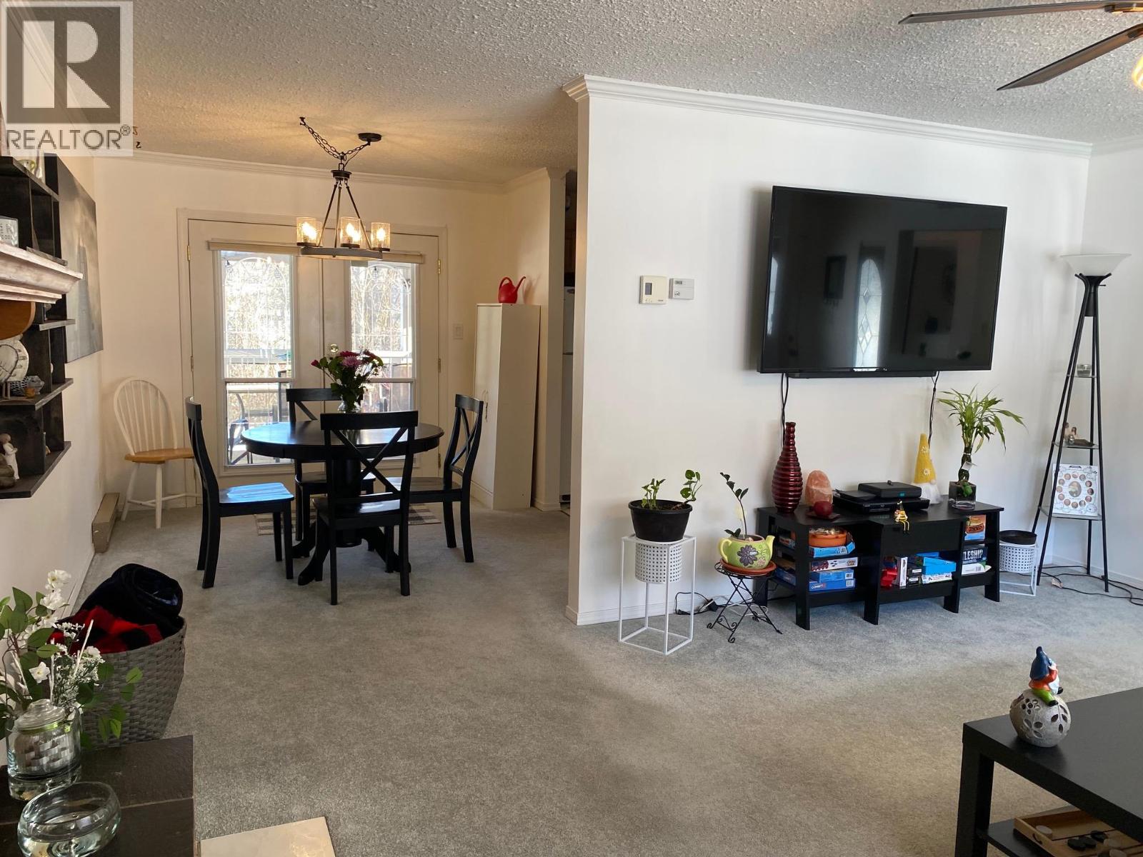 Dining room attached to living room and kitchen