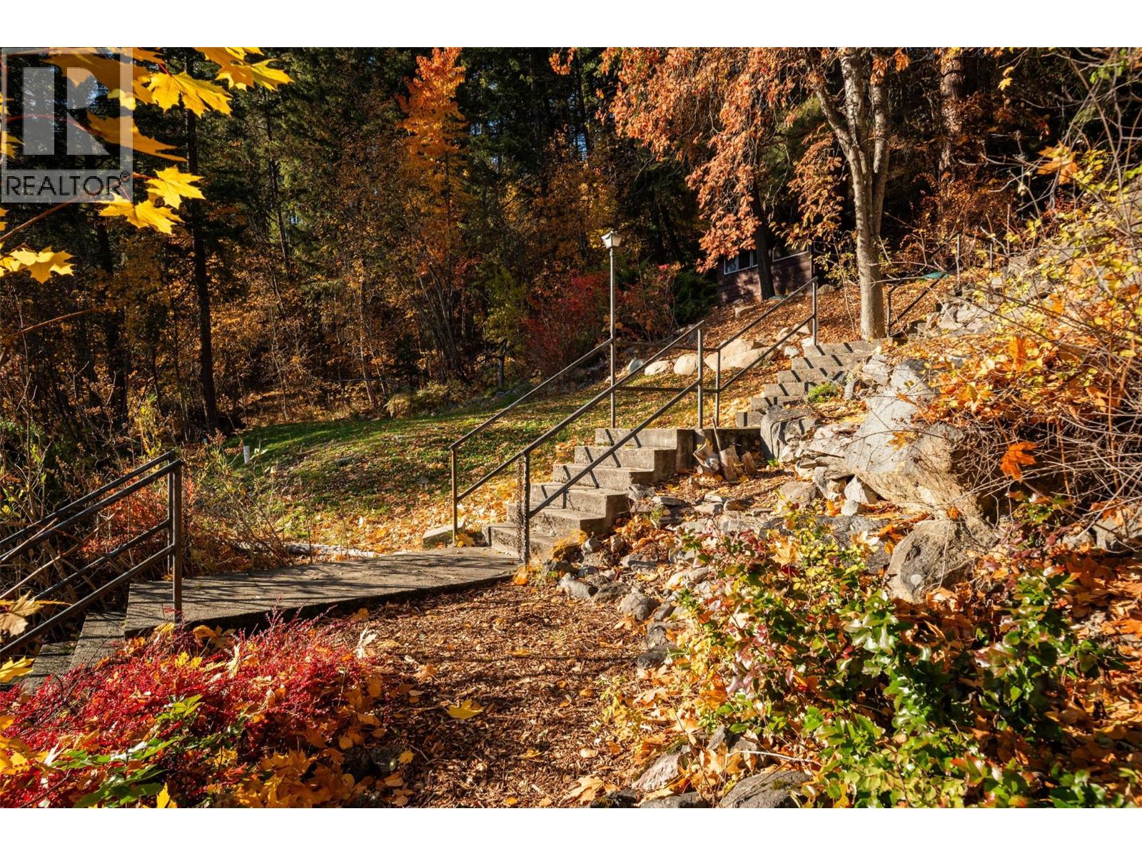 Front of property side stairs for quick access to walk down the driveway.