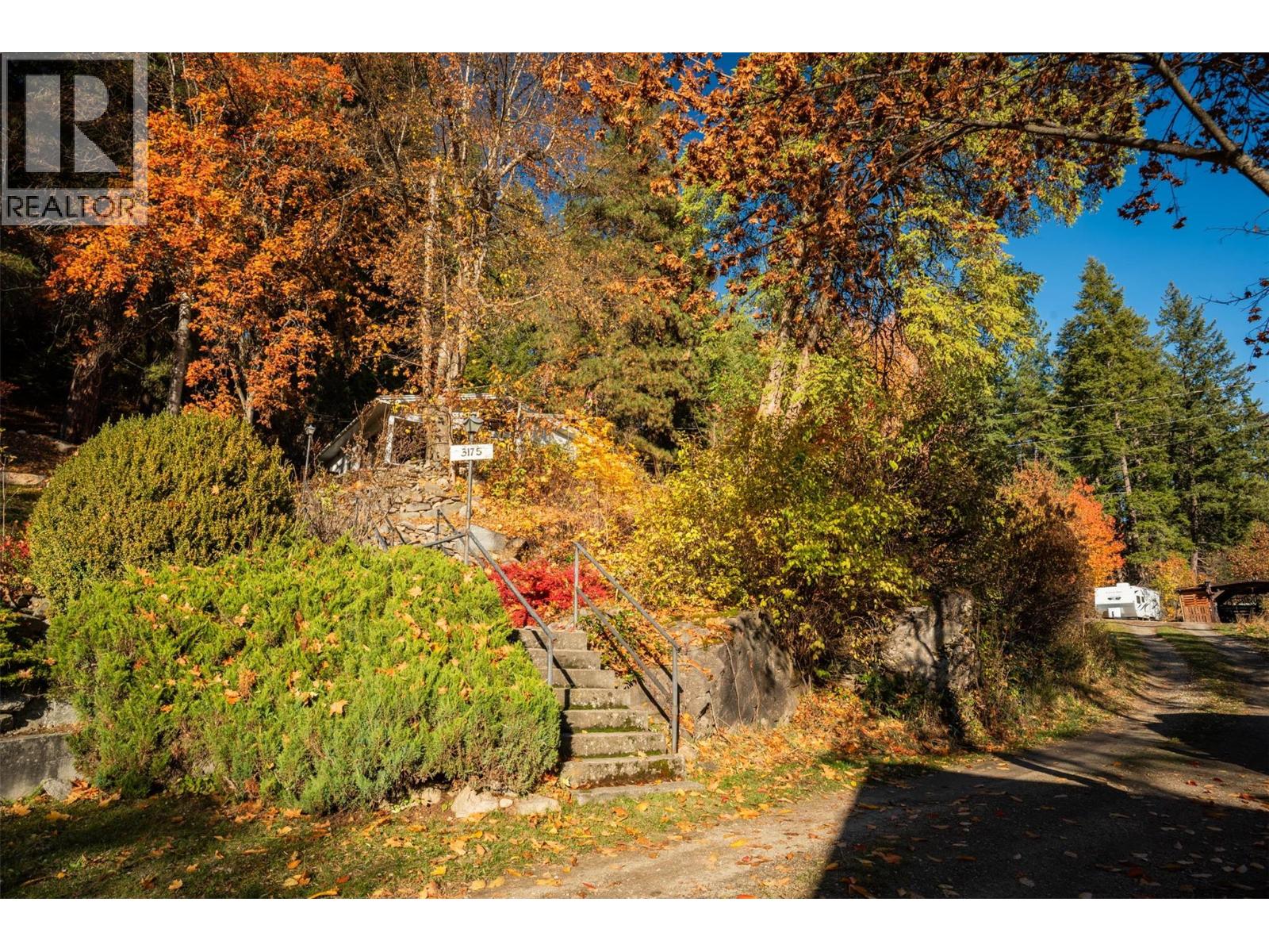 Front of property side stairs for quick access to walk down the driveway.