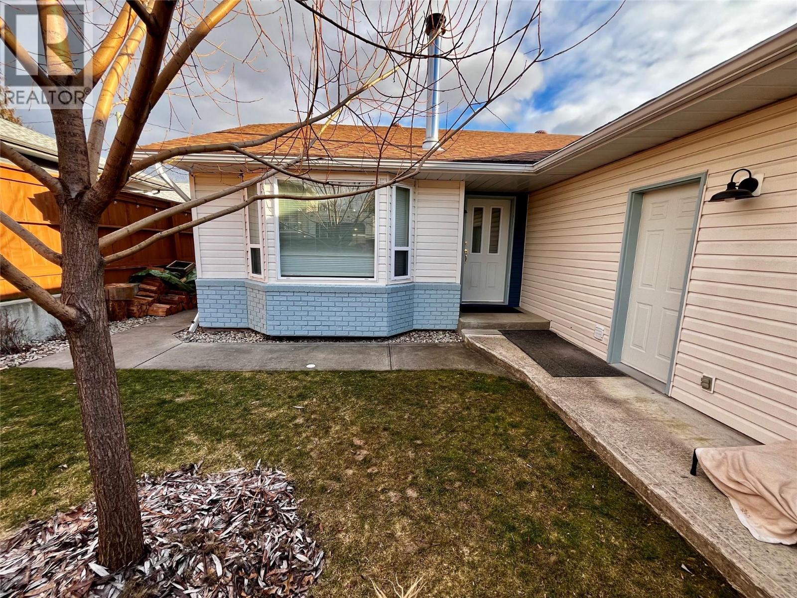 Front yard, main entry, and side door to garage