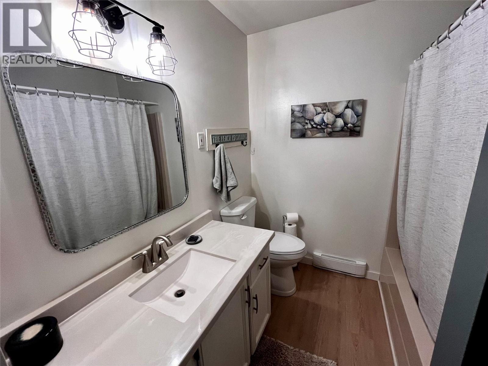 Main bathroom with tub and shower and new toilet