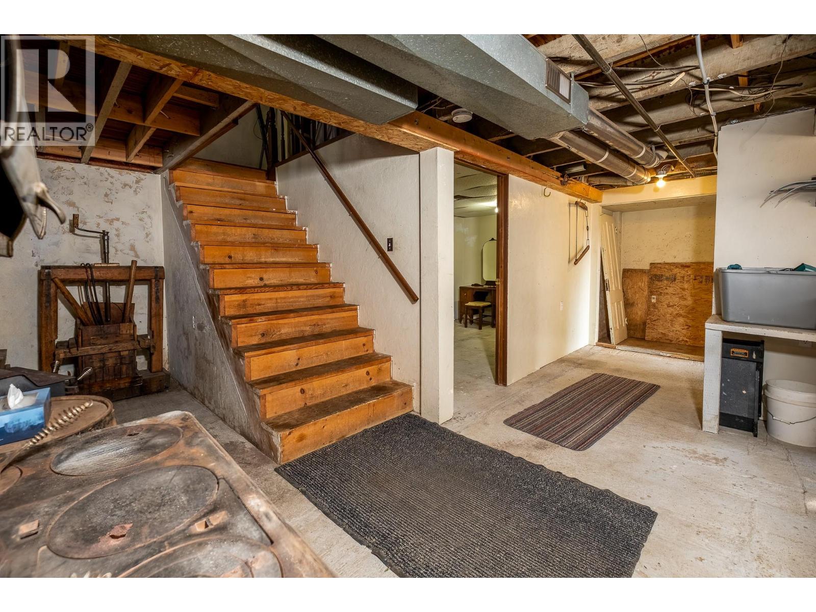 Stairs do not have a rail on one side.