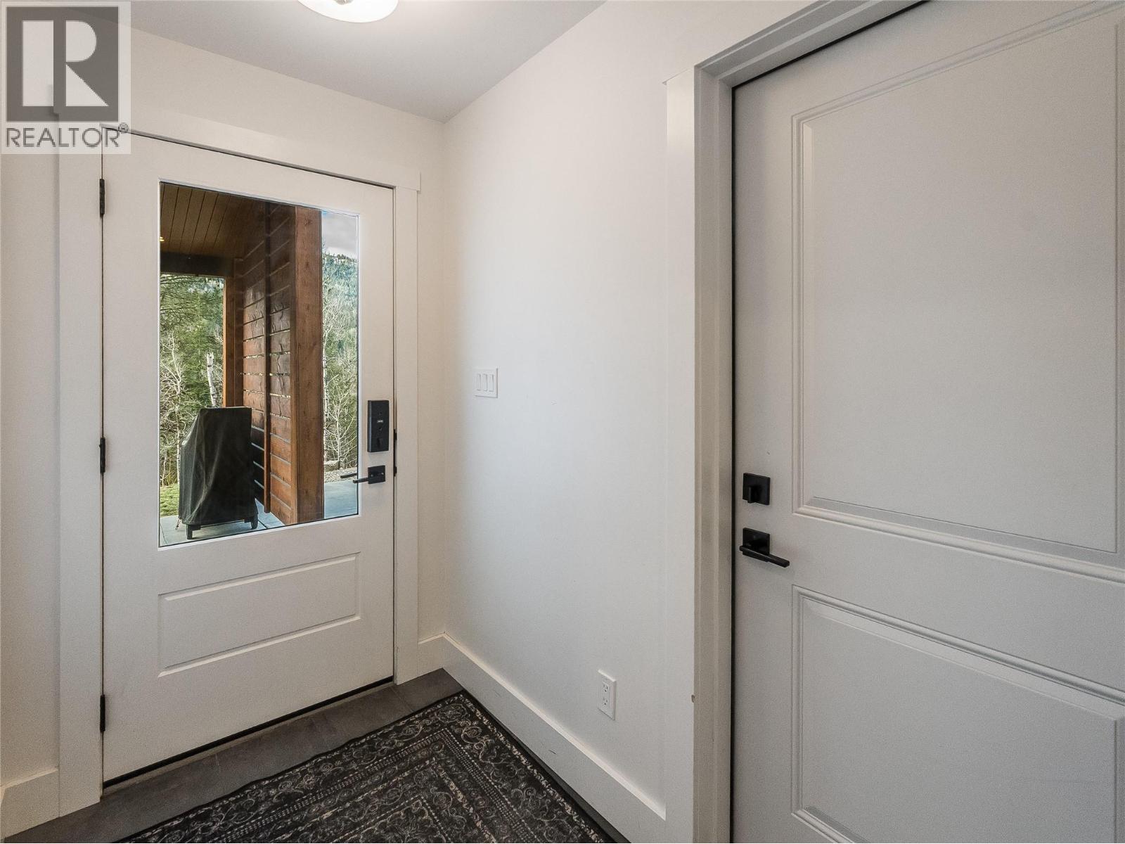 Enter into the front door and the garage door is to your left