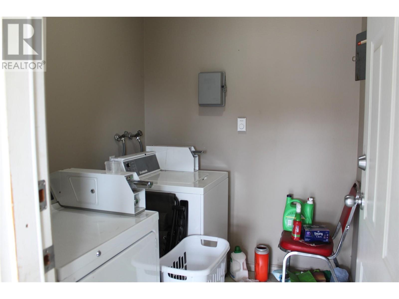shared coin operated laundry area between unit 4 and unit 3