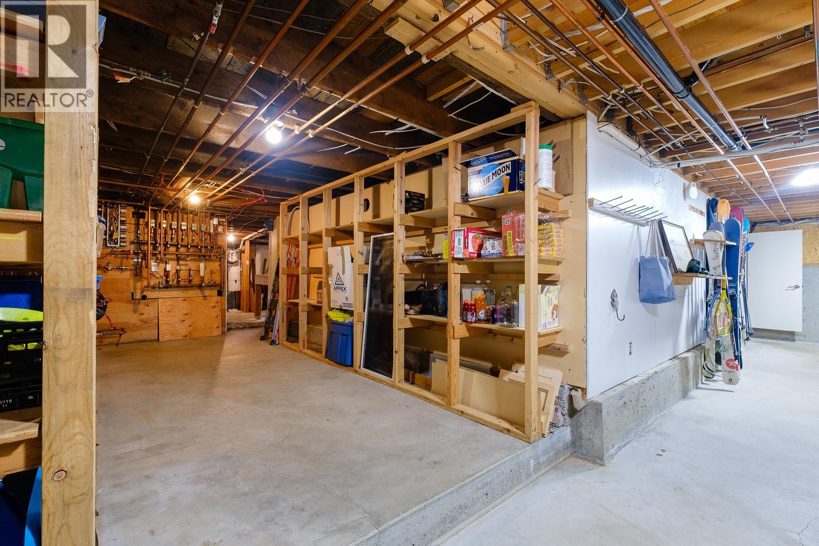 Basement with workbench and tons of storage.