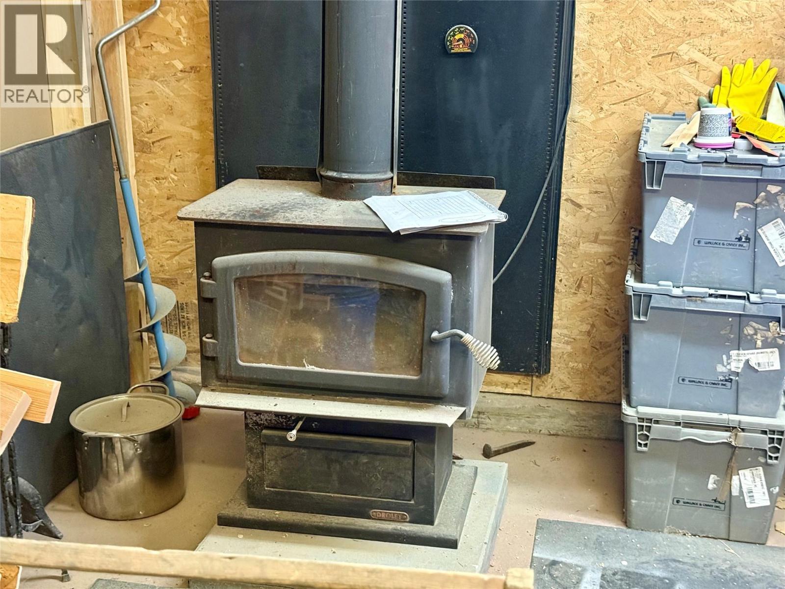 WETT cert wood stove inside shop.