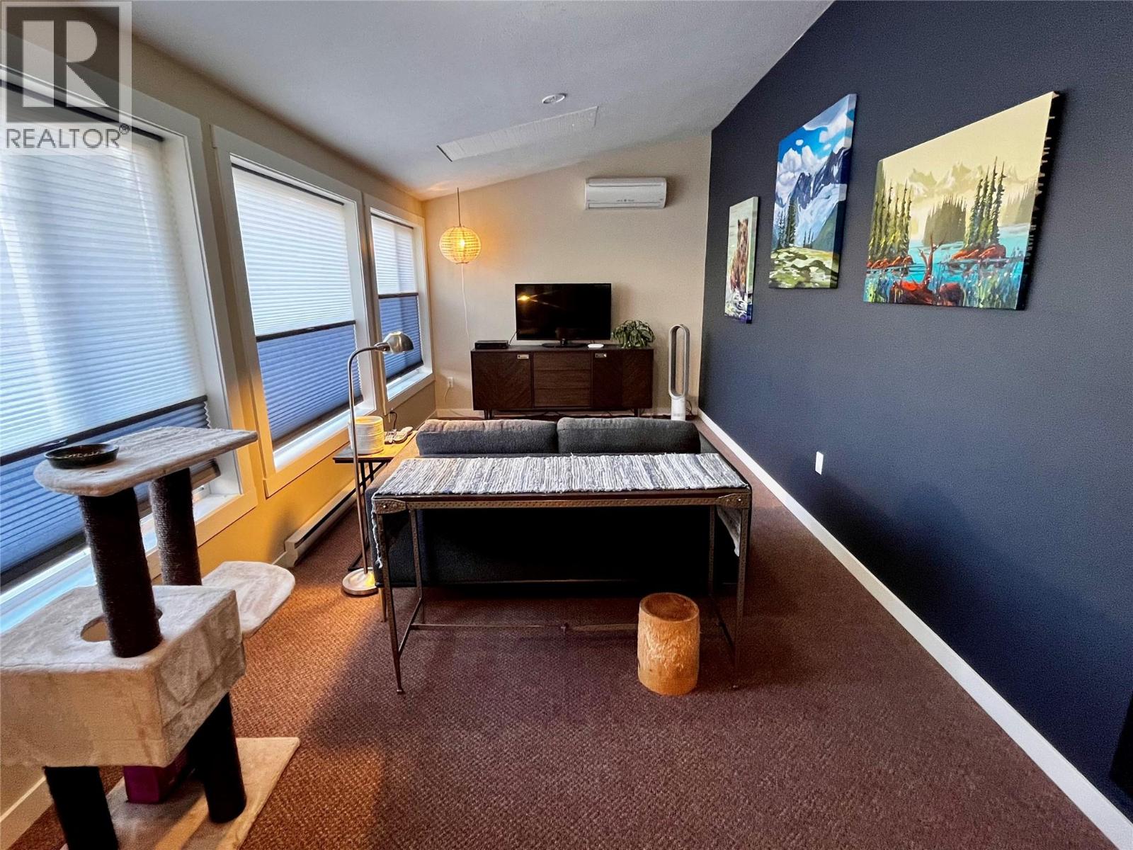 This flex space currently used as a TV room but could be a bedroom, office, studio, den, study...