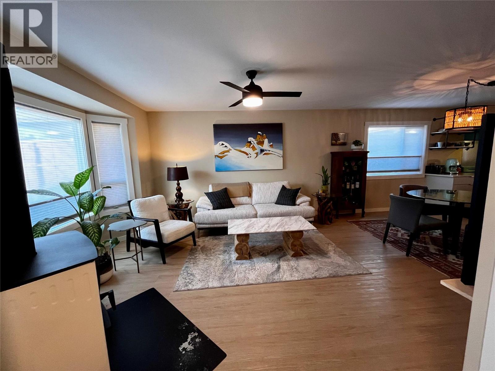 Living room anchored by brand new modern wood stove