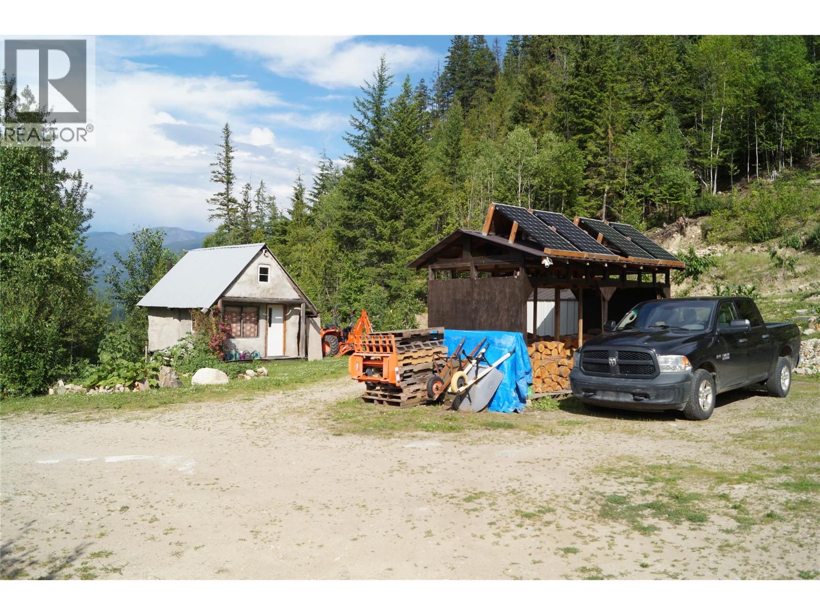 Secondary Straw-Bale Cabin, Woodshed, Solar panels
