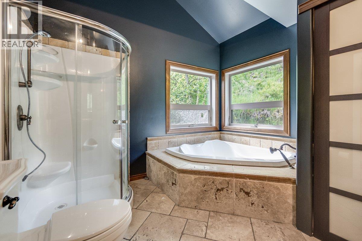 Travertine heated floors with spa tub and shower