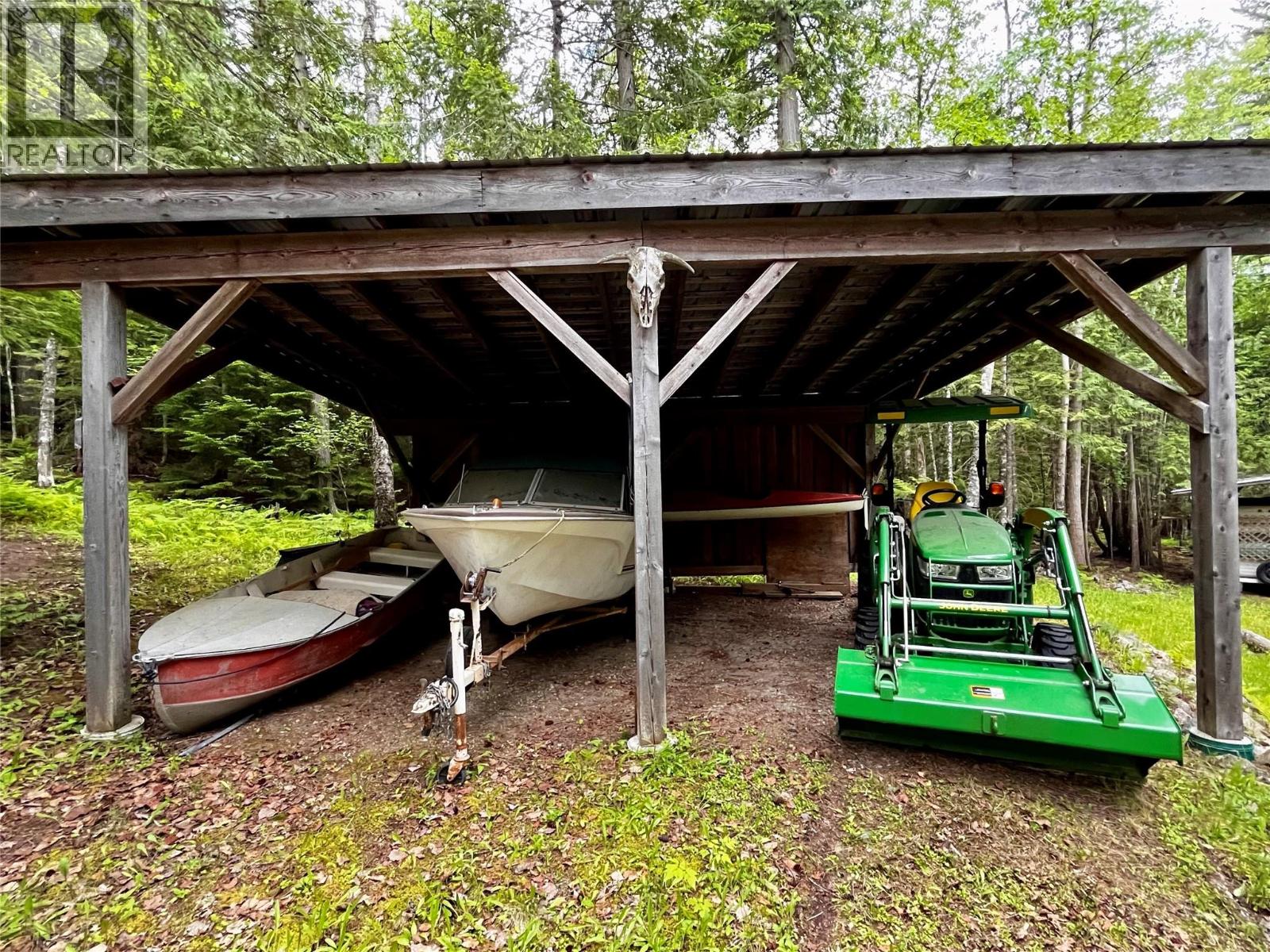 Two bay carport for equipment and toys