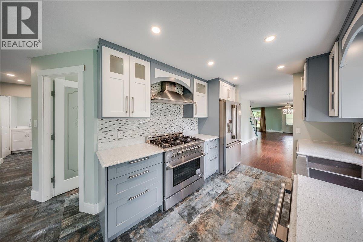 Beautifully updated kitchen with 6 burner range and a full walk-in pantry
