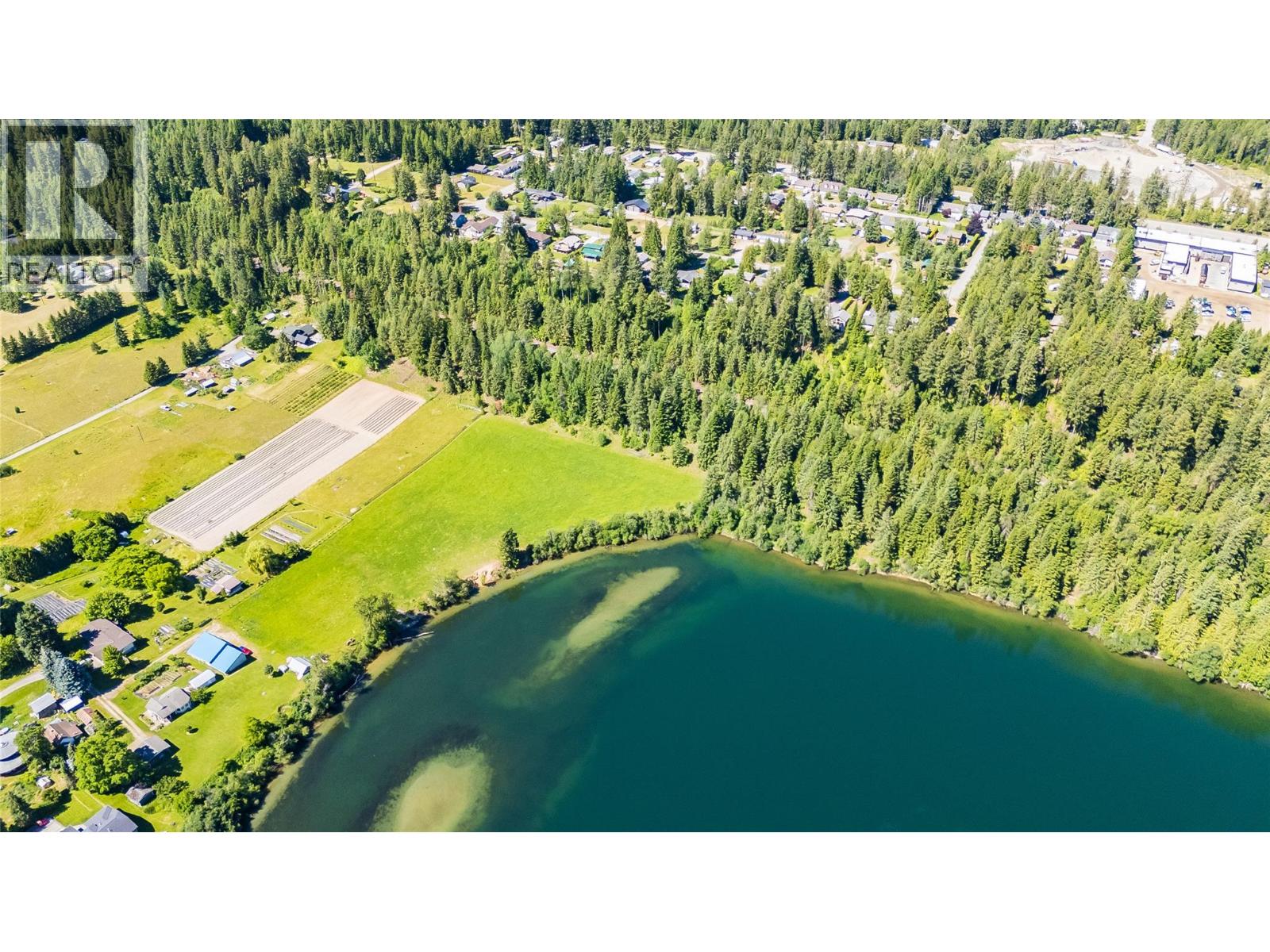 house is on the ridge above the water