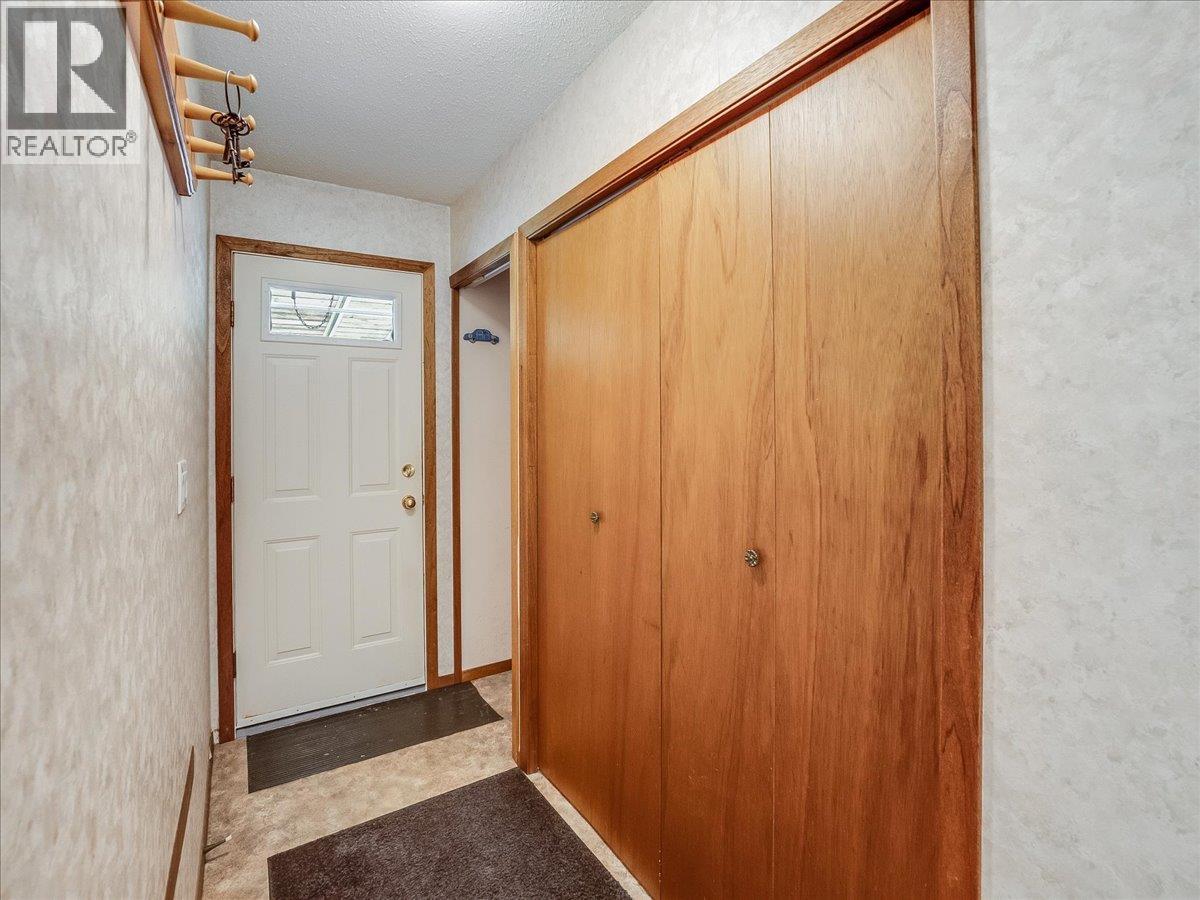 Hallway to Back Door Walk-Out and Laundry Doors