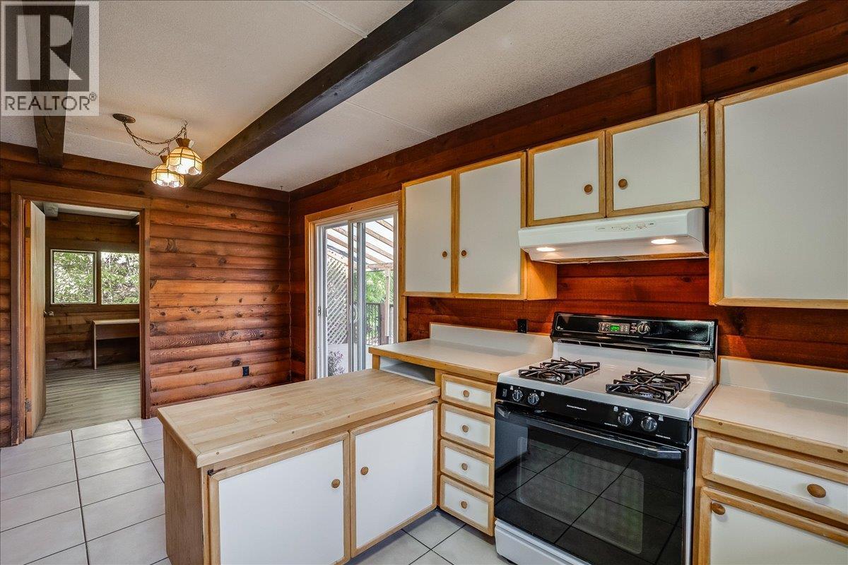 Kitchen with access to wrap around deck.