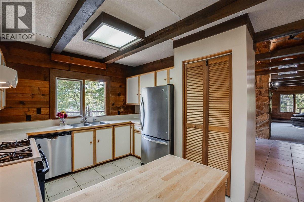 Kitchen with access to wrap around deck.