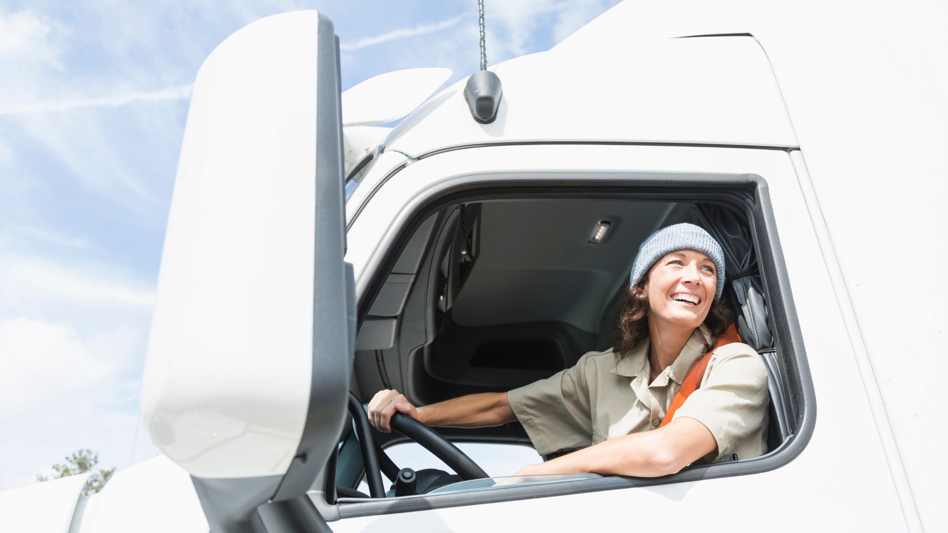 Woman Driving a White Semi Truck