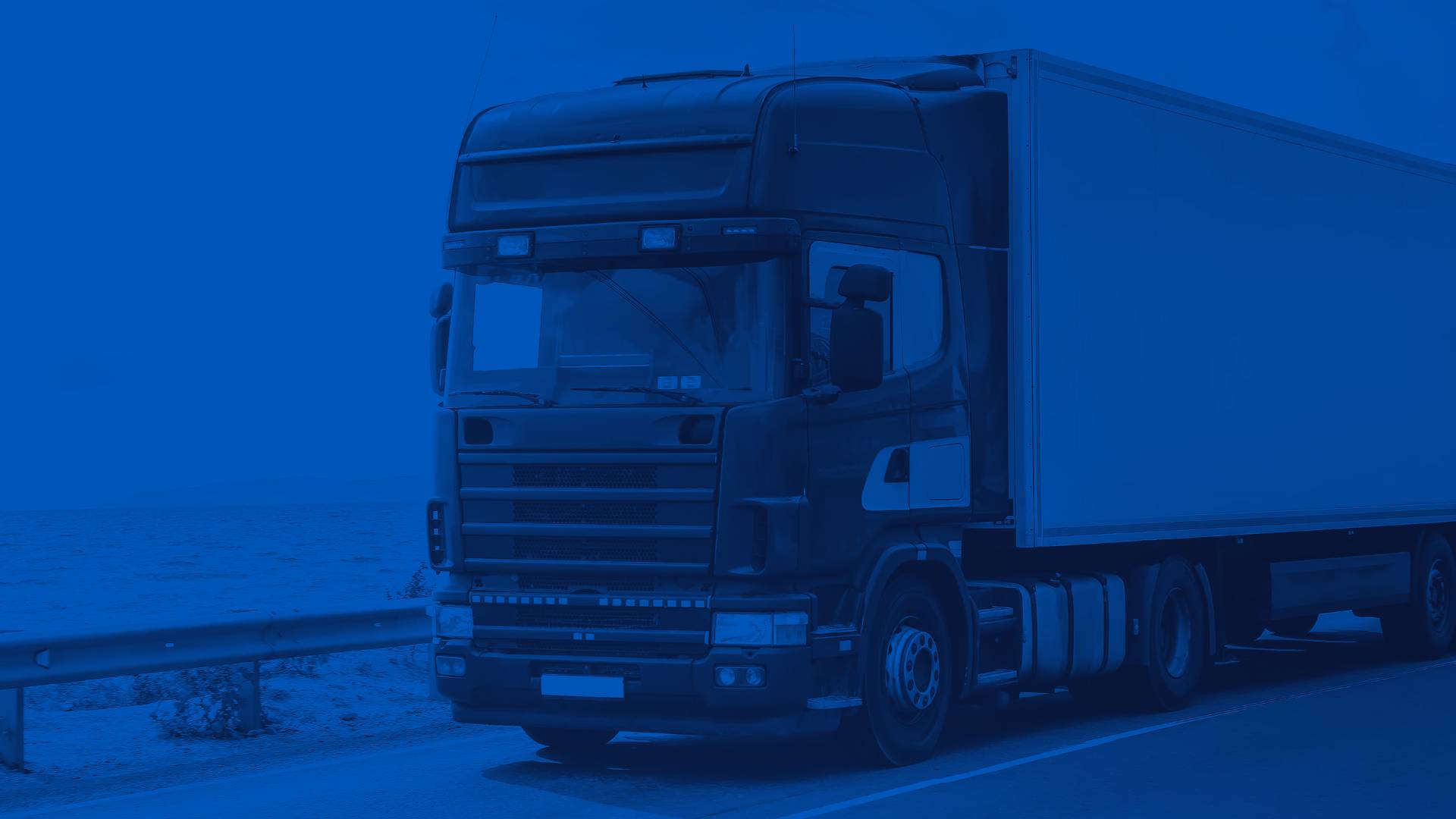Blue Semi Truck on a Desert Highway