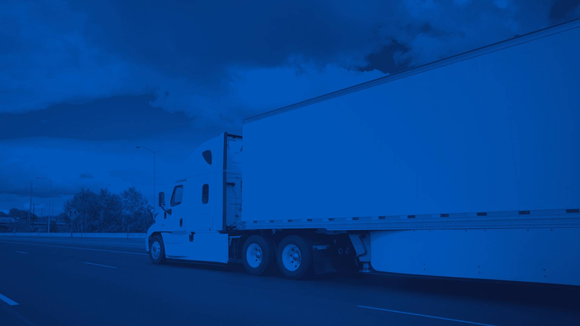 White Semi Truck Driving on Highway