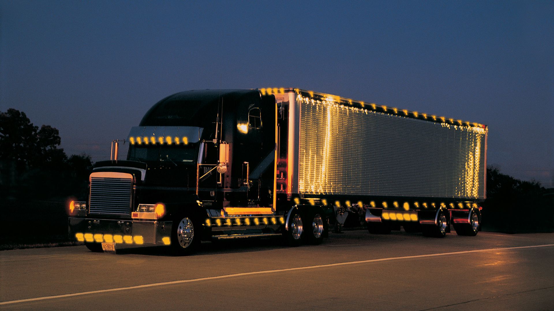 Black Semi Truck Lit Up at Night