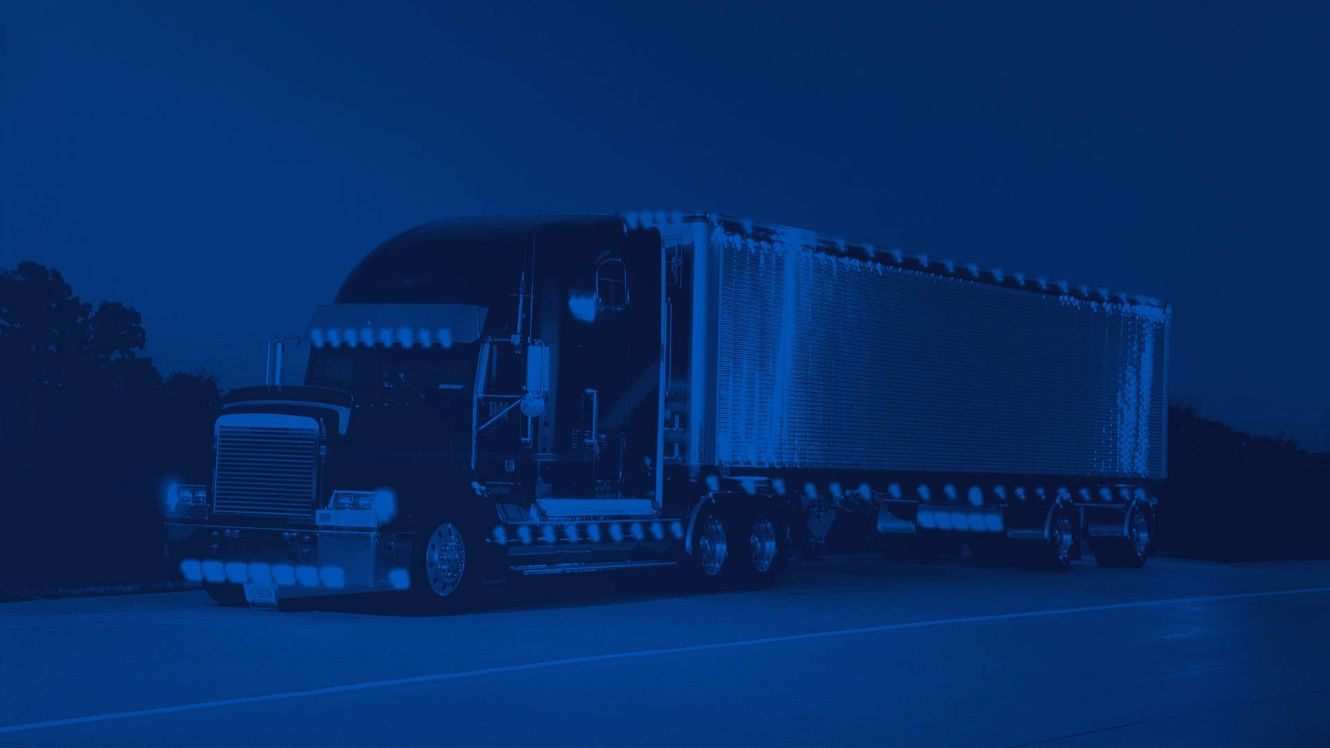 Black Semi Truck Lit Up at Night