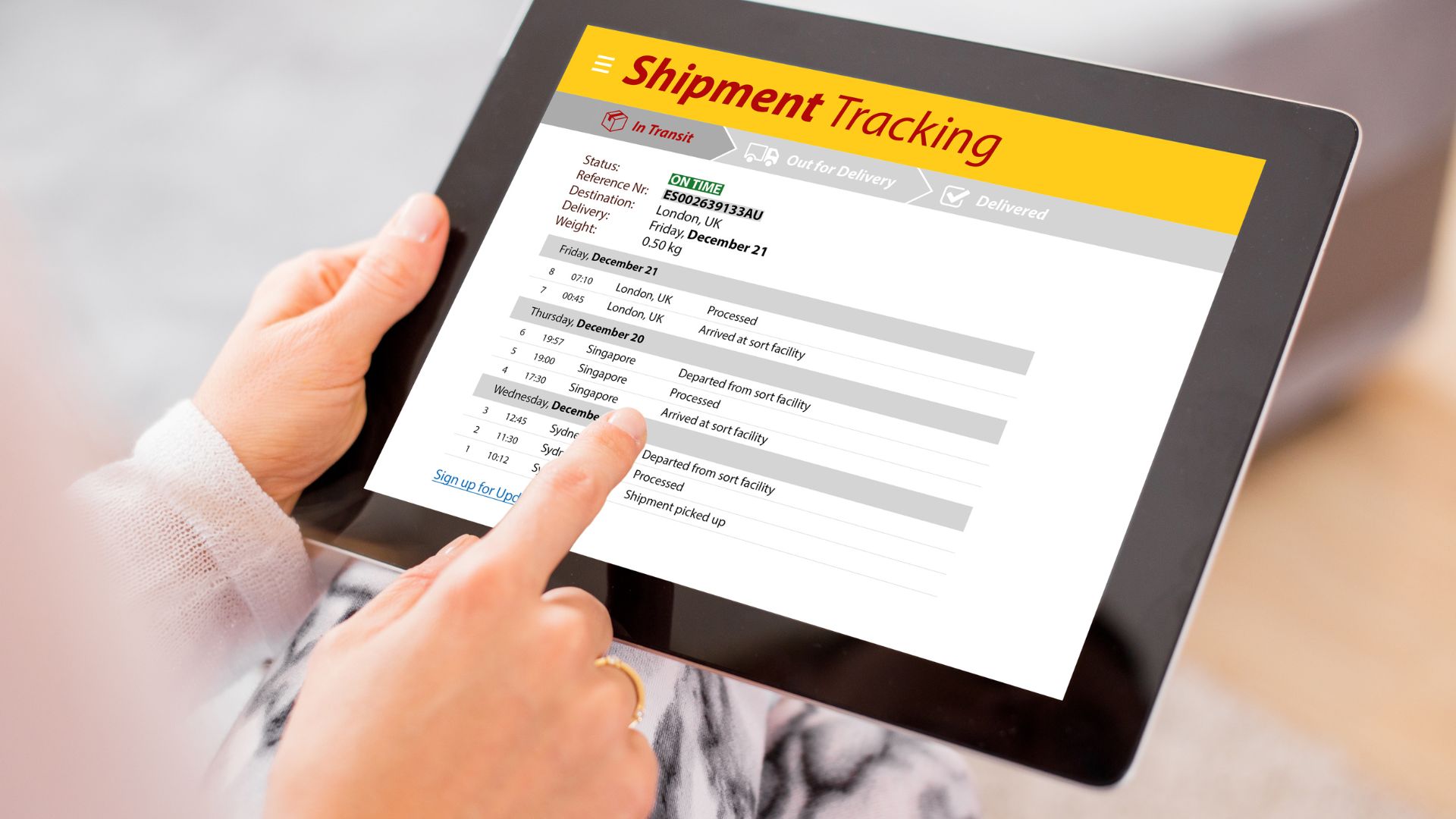 Person Looking at Shipment Tracking Information on a Tablet