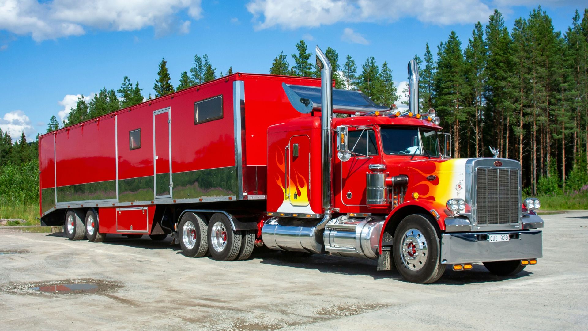 Red Semi Truck with Flames on a Road