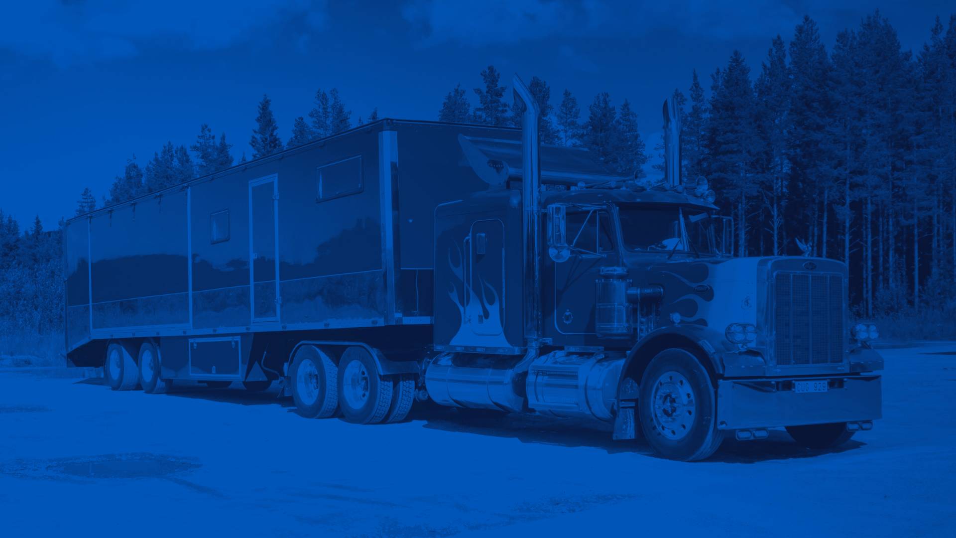 Red Semi Truck with Flames on a Road