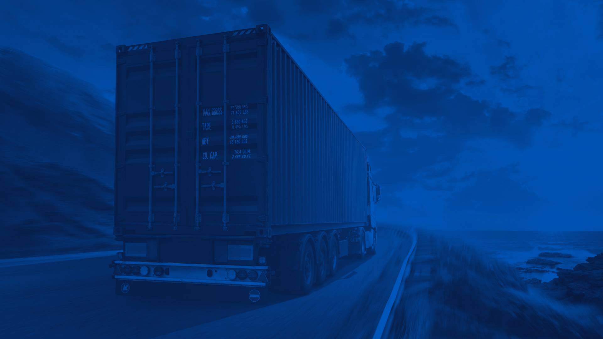 Commercial Truck Rear Exterior on a Coast Road at Sunset
