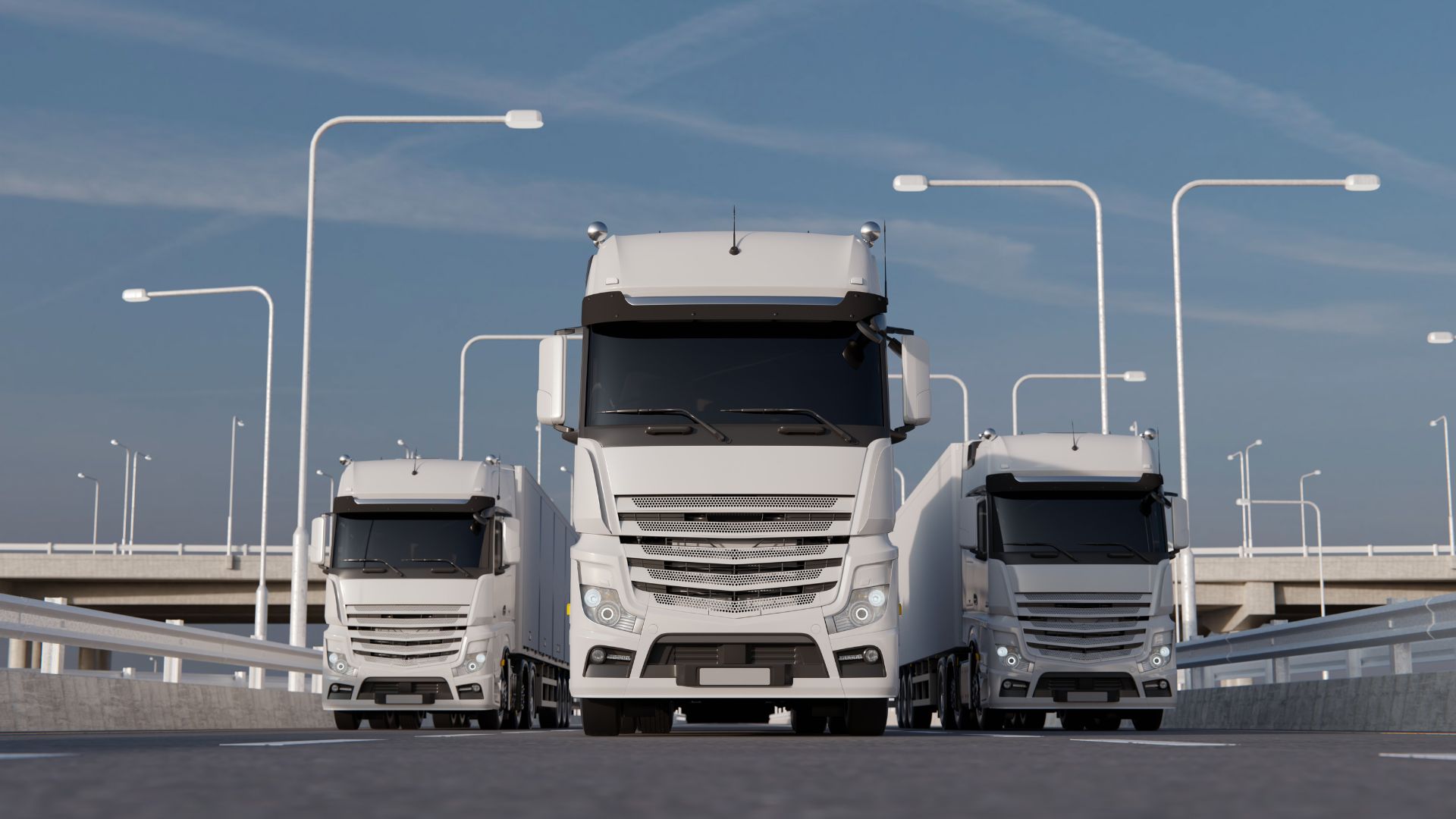 Three White Semi Trucks on a Freeway