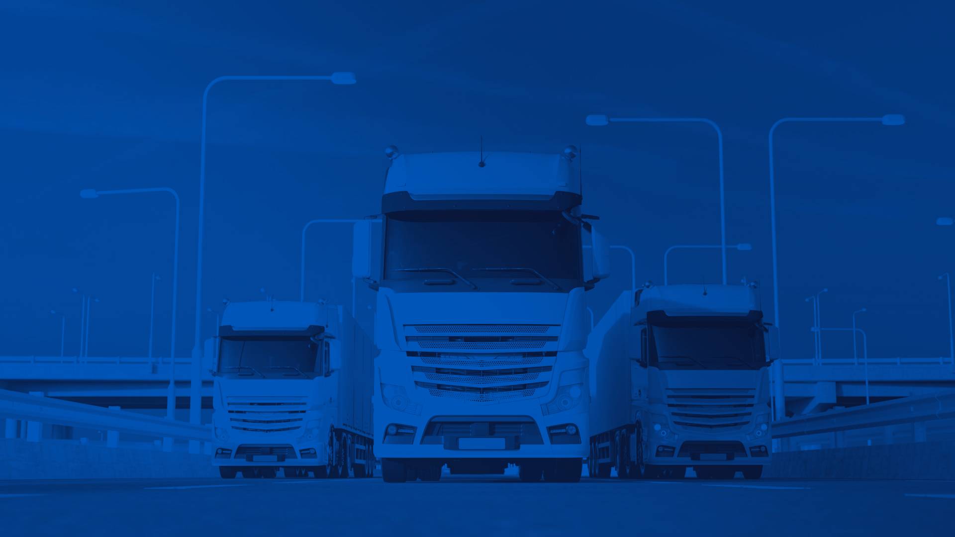 Three White Semi Trucks on a Freeway