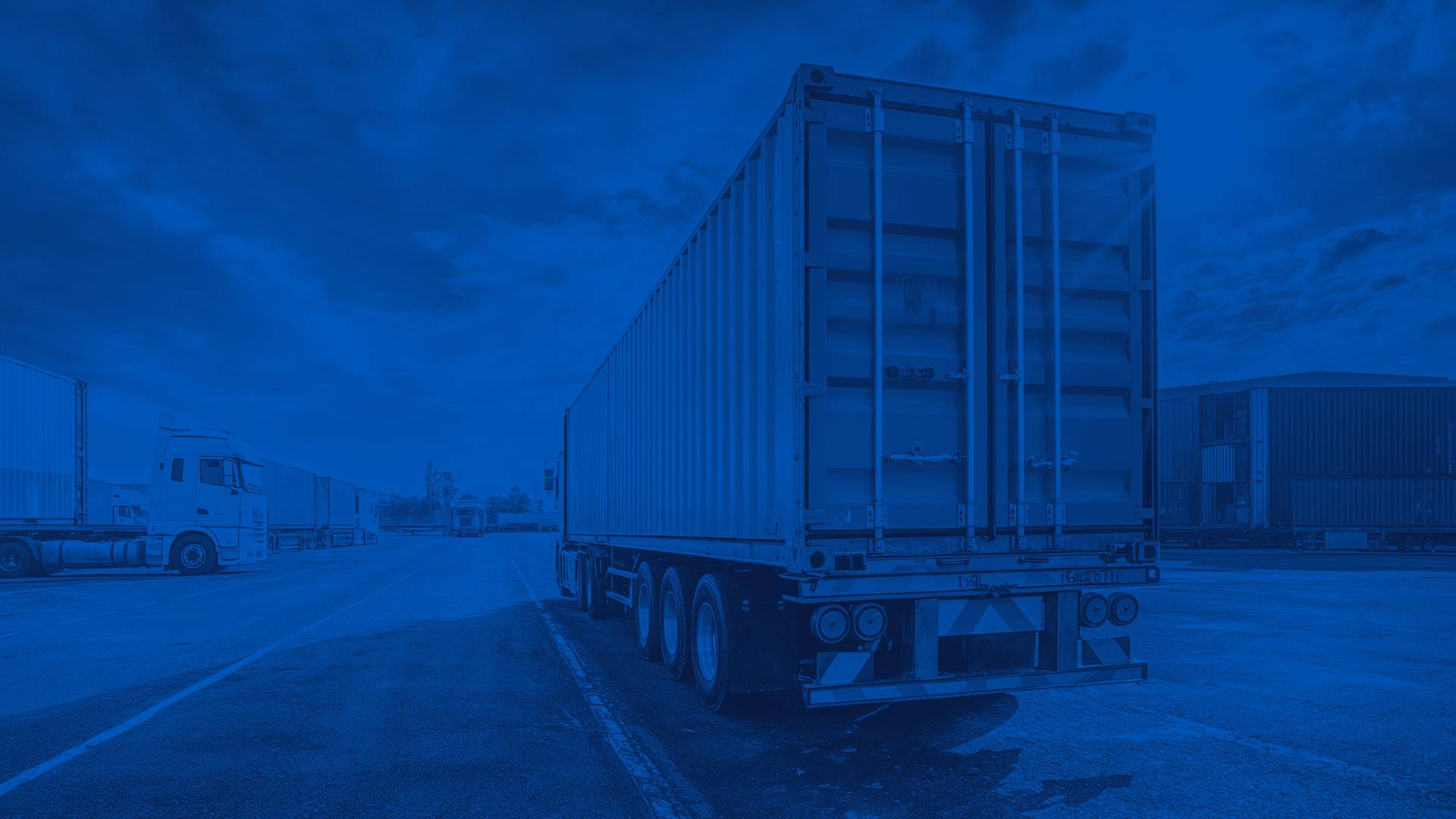 Rear Exterior of Orange Semi Trailer in a Lot