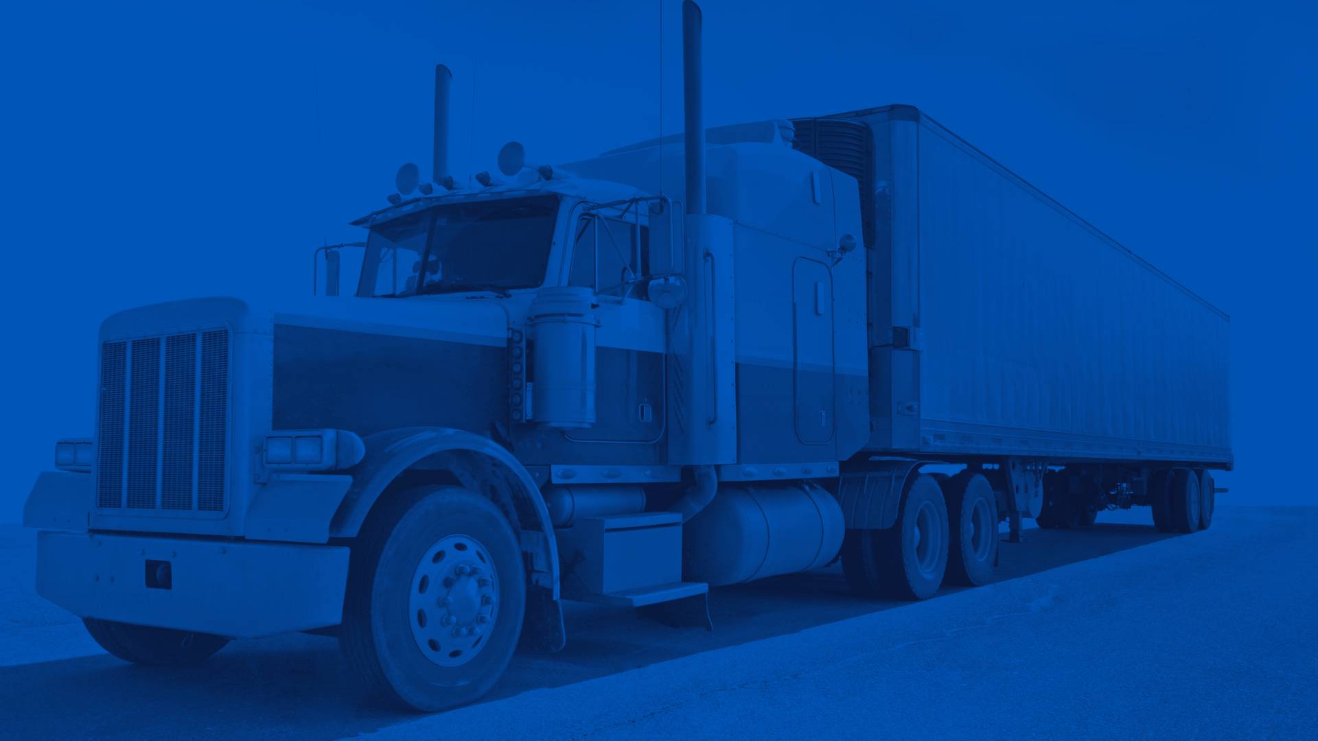 Gray and White Semi Truck on a Road