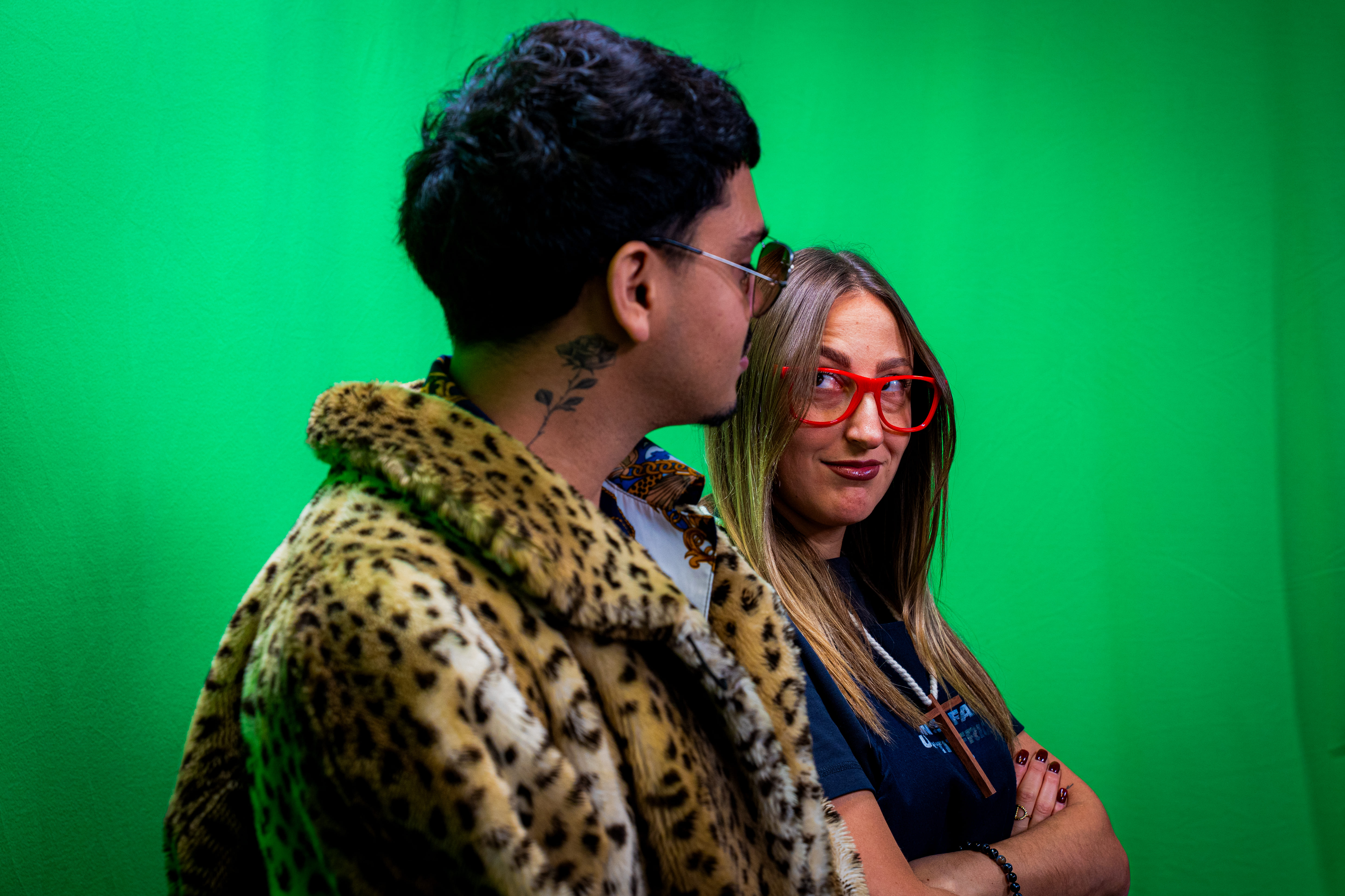 Man and woman are looking at each other in a defiant funny way