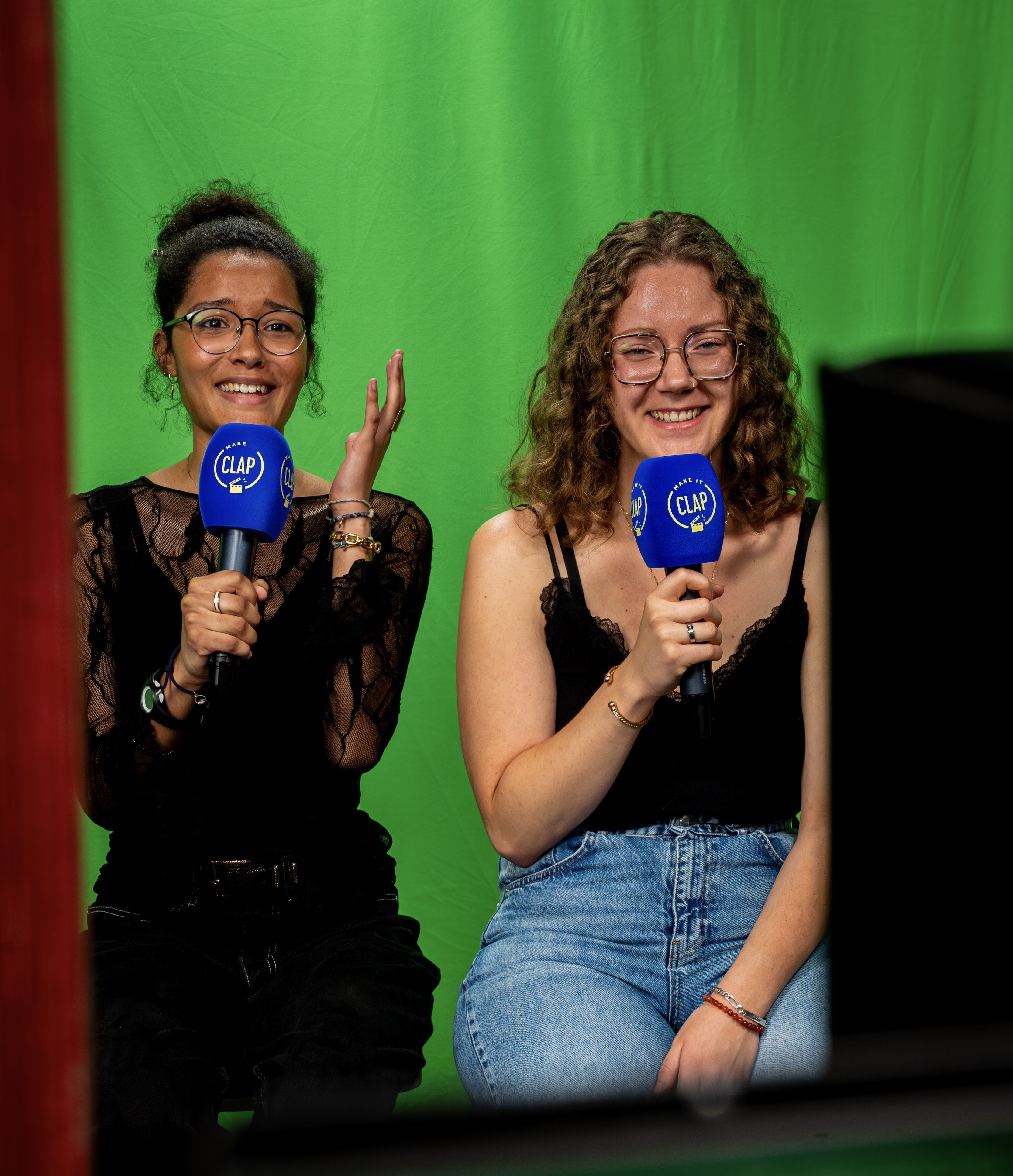 Two friends are presenting weather forecast and laughing