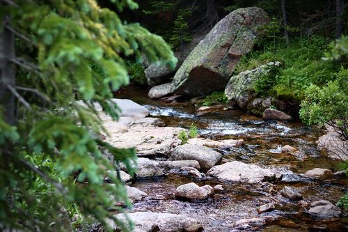 A roaring waterfall rushing down a canyon