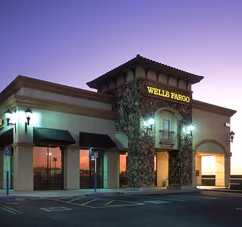 Wells Fargo bank building in the evening with lights on