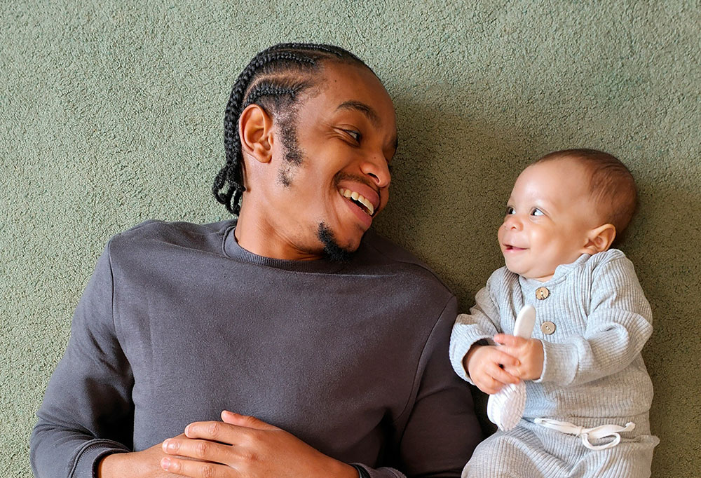 Father smiling with baby
