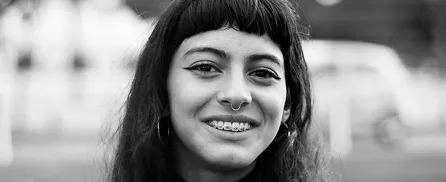 Young woman with braces smiling