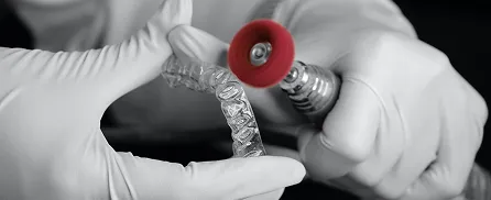 Dental tech preparing Invisalign tray