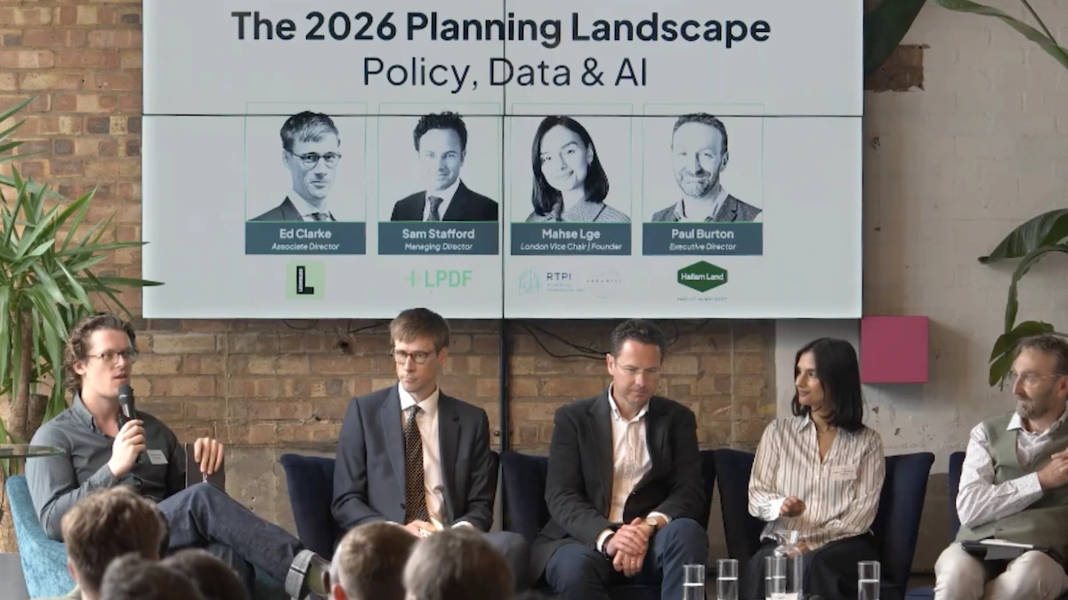 Panel discussion at Searchland's 2026 Planning Landscape event, with speakers from Lichfields, LPDF, RTPI and Hallam Land seated on stage