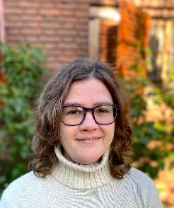 A person wearing glasses and a turtleneckAI-generated content may be incorrect.